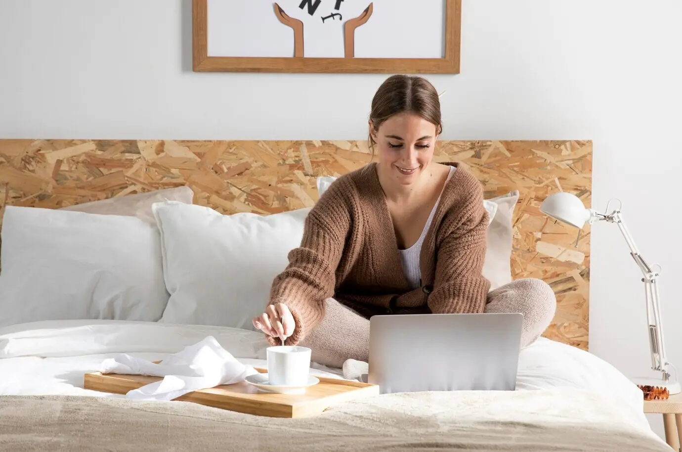 Full-length shot of a freelancer working in a bedroom